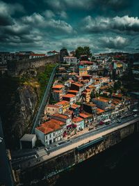 High angle view of illuminated cityscape against sky at night