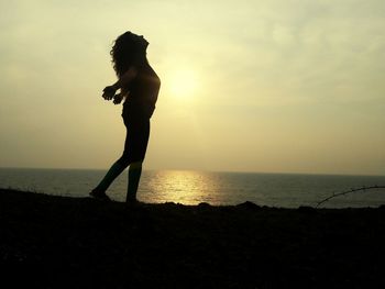 Scenic view of sea at sunset