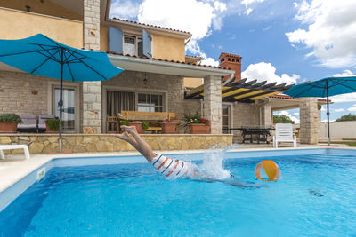 Man swimming in pool