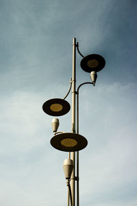 Low angle view of street light against sky