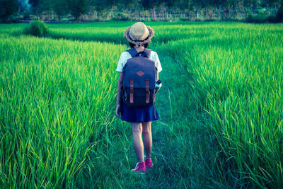 Full length of child standing on field