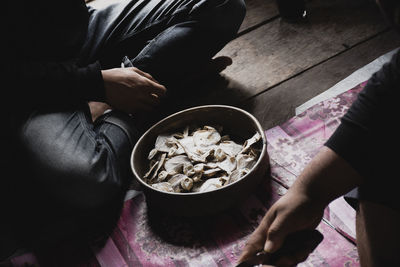 High angle view of woman sitting on table