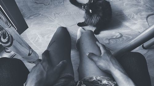 Low section of woman sitting on floor