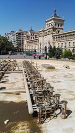 View of empty fountain against clear blue sky