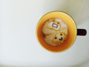 Directly above shot of coffee cup on table