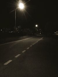 Illuminated street lights at night