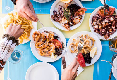 High angle view of person preparing food on table