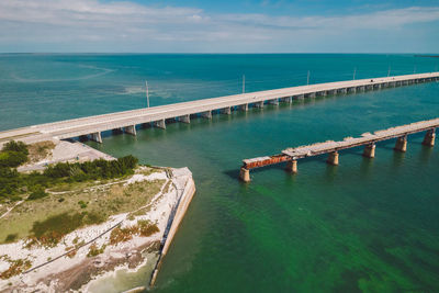 Bridge over sea against sky