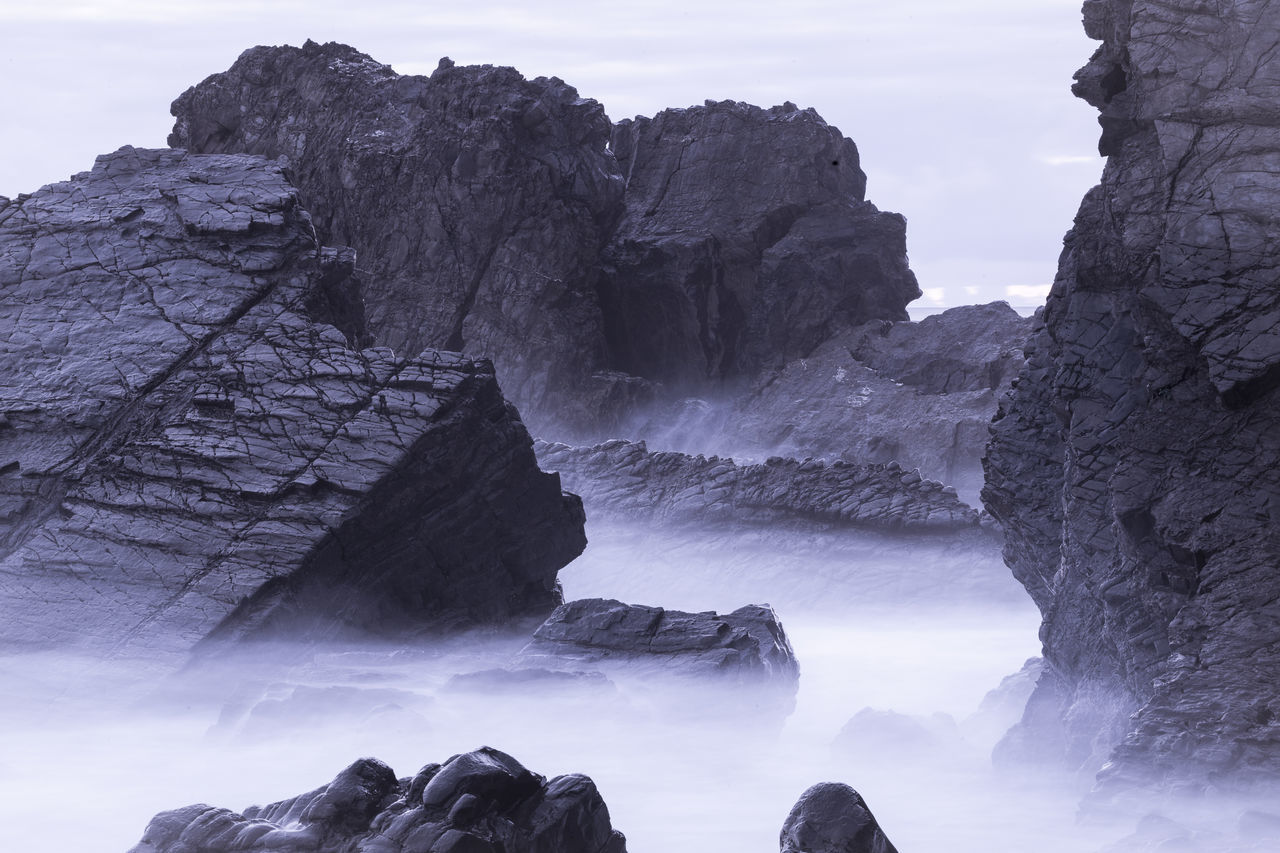 rock, rock formation, rock - object, beauty in nature, scenics - nature, solid, water, tranquility, tranquil scene, nature, sky, geology, non-urban scene, day, physical geography, mountain, no people, outdoors, sea, formation, flowing water, eroded