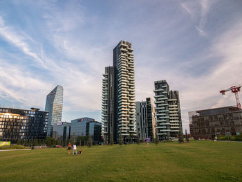 Buildings in city against sky