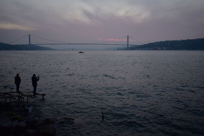 View of suspension bridge over sea