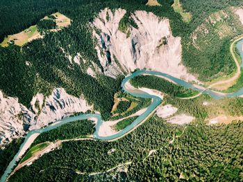 High angle view of stream amidst land