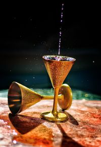 Close-up of wineglass on table