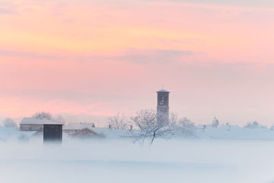 Building against sky during winter