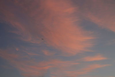 Low angle view of cloudy sky at sunset