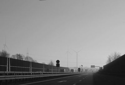 Man on road against clear sky