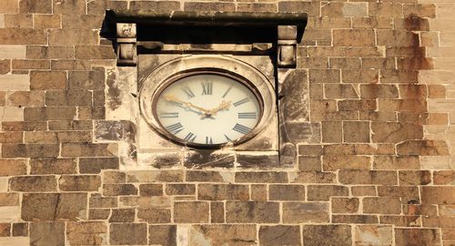 Low angle view of clock on building