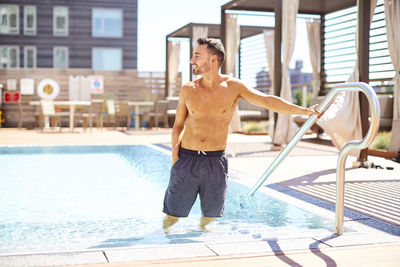 A man standing in the pool.