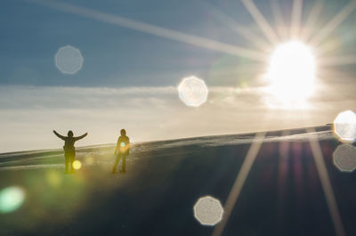 Low angle view of bubbles against sky on sunny day