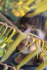 Close-up portrait of girl with flowers