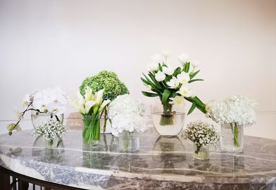 Close-up of white flowers in vase on table