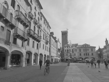 People walking on street in city