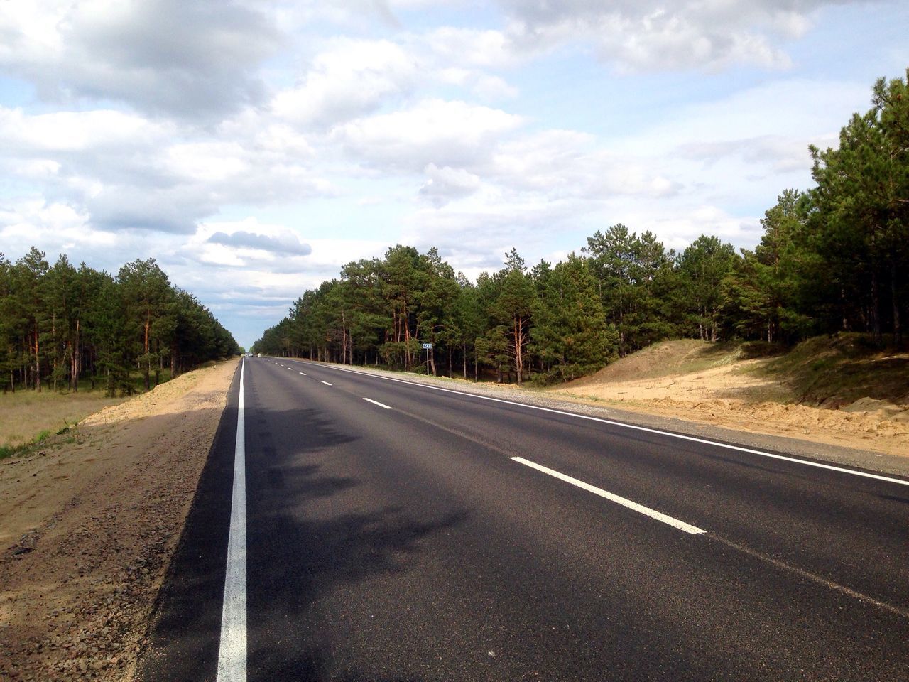 road, tree, sky, the way forward, cloud - sky, transportation, tranquility, day, nature, scenics, landscape, no people, tranquil scene, outdoors, growth, beauty in nature