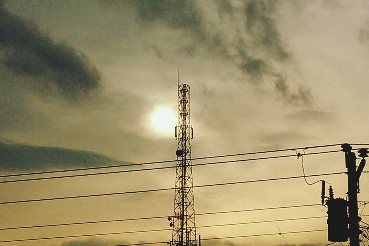 low angle view, electricity, electricity pylon, power line, power supply, sky, connection, fuel and power generation, technology, silhouette, cloud - sky, cable, cloudy, dusk, cloud, construction site, built structure, sunset, outdoors, no people