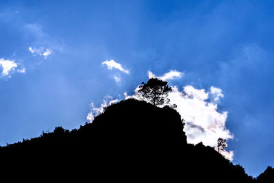 Low angle view of silhouette mountain against sky