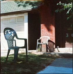 Chairs and trees against building