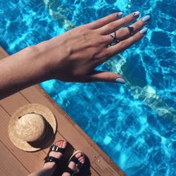 High angle view of woman standing at poolside