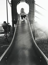 Rear view of people at playground