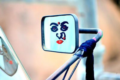 Anthropomorphic face on vehicle mirror