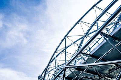 Low angle view of metallic structure against sky