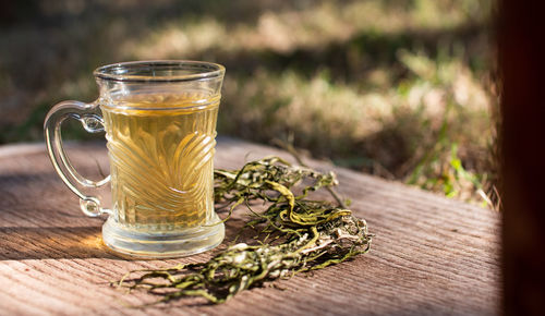 Close-up of tea in glass on table