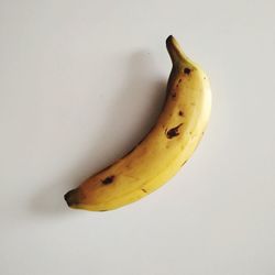 High angle view of banana against white background