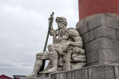 Low angle view of statue against sky