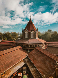 High angle view of roof of british architectural building against sky 