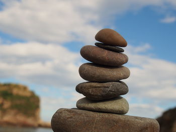 Close-up of stack of stones by the beach