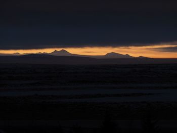 Scenic view of silhouette landscape against sky during sunset