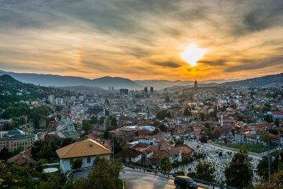 High angle view of townscape against sky during sunset