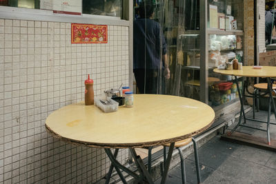 Empty chairs and tables in restaurant