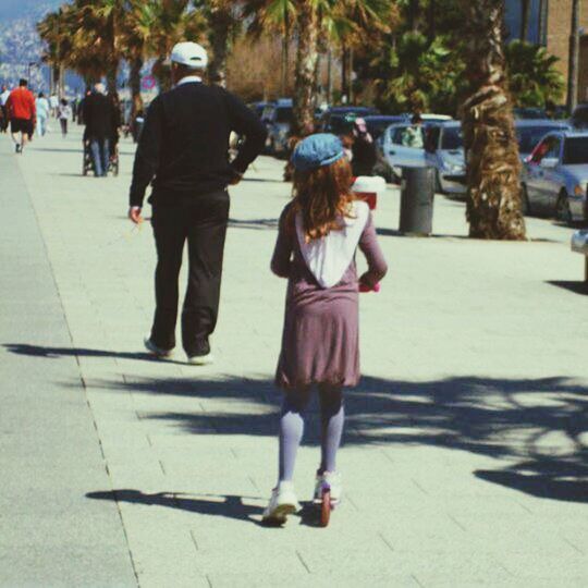 full length, lifestyles, casual clothing, street, rear view, walking, leisure activity, childhood, girls, elementary age, boys, sidewalk, person, sunlight, day, togetherness, incidental people