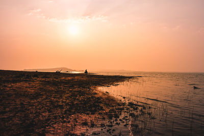 Scenic view of sea against sky during sunset