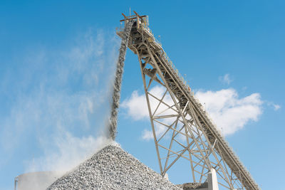 Stockpile and conveyor belt at an open-pit copper mine in latin america