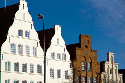 Low angle view of building against blue sky