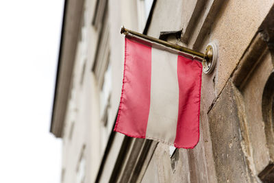 Close-up of flag hanging on building