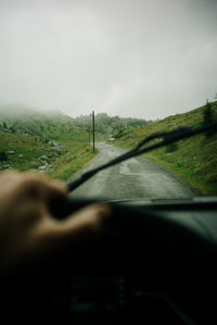 Road seen through car windshield