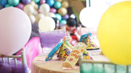 Close-up of multi colored balloons on table