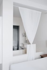 White curtain on bed at home